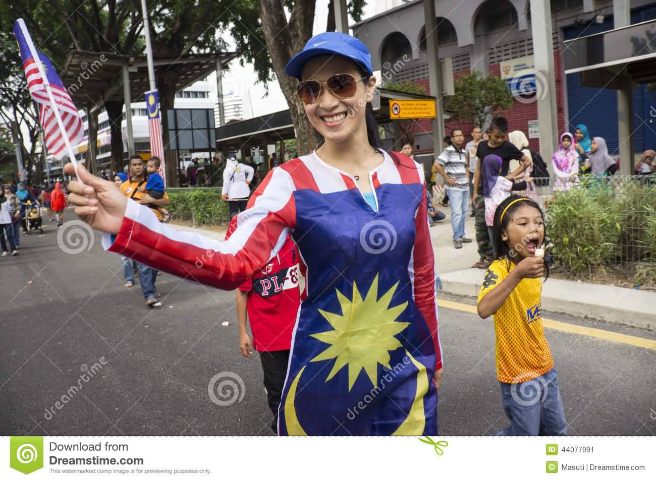 Malaysian Girl With Flag On Malaysia Day Parade