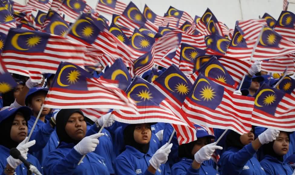Malaysian Kids With Flags During Malaysia Day Celebration