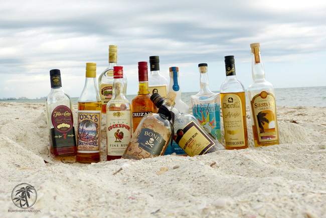 National Rum Day Empty Bottles Of Rum On Beach Sand
