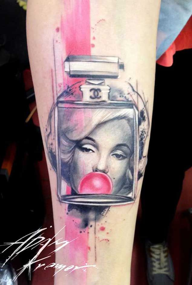 Nice Bubble Gum Marilyn Monroe Tattoo On Arm