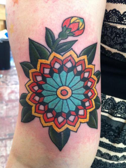 Nice Colored Old School Flower Tattoo On Triceps