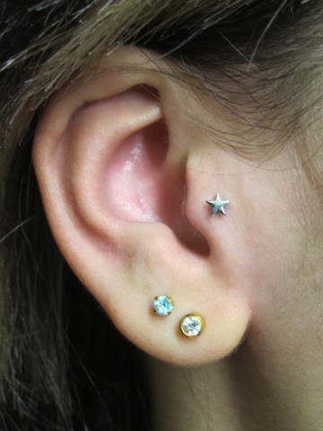 Nice Double Lobe And Tragus Piercing With Star Stud