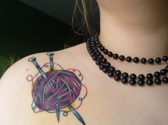 Nice Knitting Needles In Yarn Tattoo On Left Shoulder For Girls