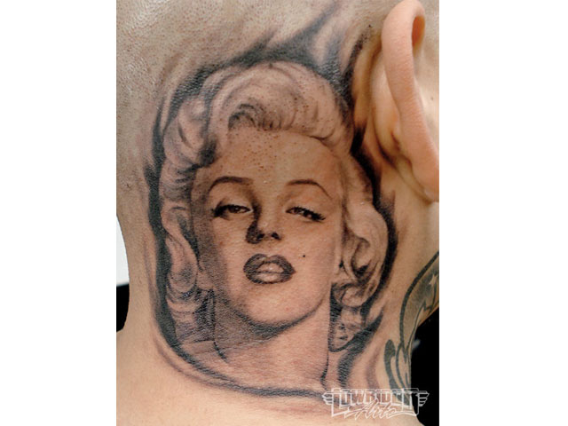 Nice Marilyn Monroe Face Tattoo On Behind Ear