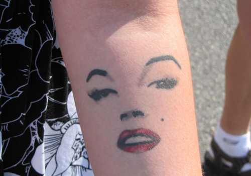 Nice Marilyn Monroe Face Tattoo On Forearm