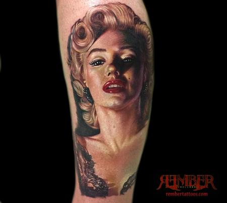 Nice Marilyn Monroe Portrait Tattoo On Arm