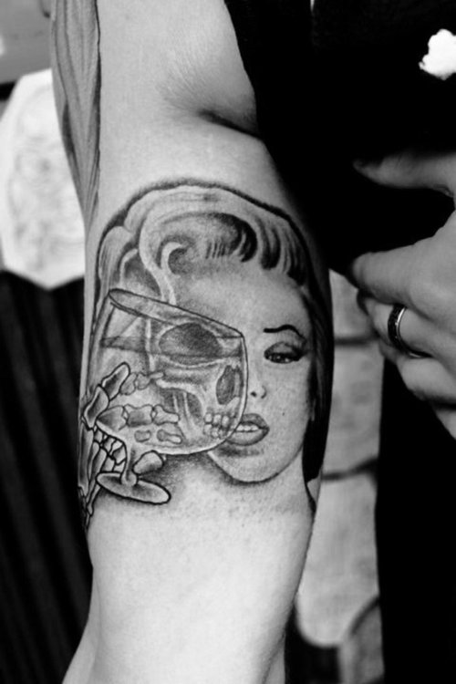 Nice Marilyn Monroe Skeleton Tattoo On Biceps