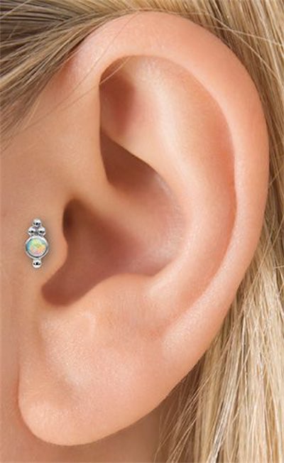Opal Stud Tragus Piercing On Left Ear