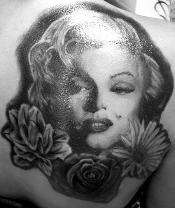 Realistic Marilyn Monroe With Flowers Tattoo