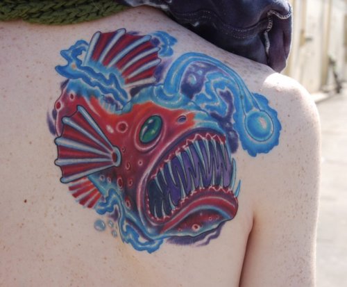 Red And Blue Angler Fish Tattoo On Right Back Shoulder
