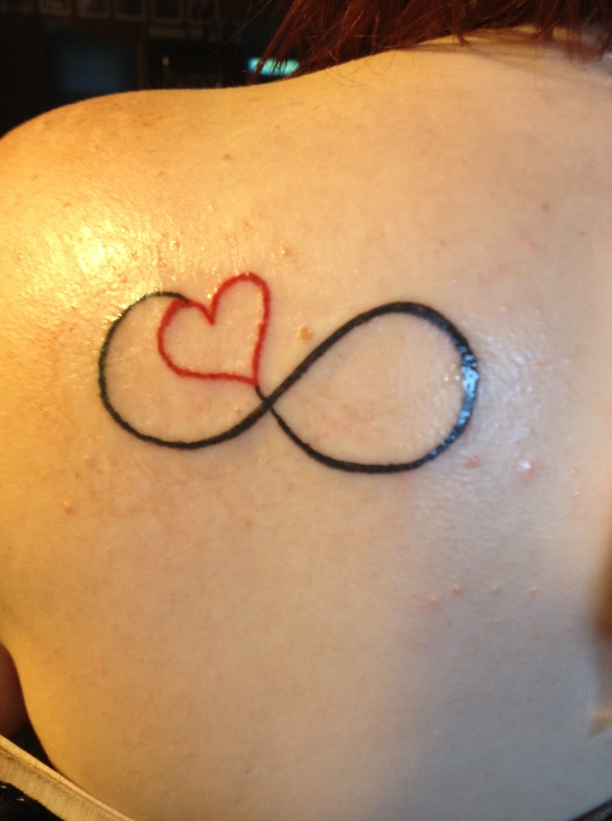 Red Heart In Infinity Symbol Tattoo On Left Back Shoulder