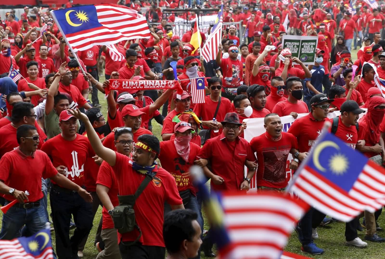 Red Shirt Demonstrators Gather For A Rally To Celebrate Malaysia Day