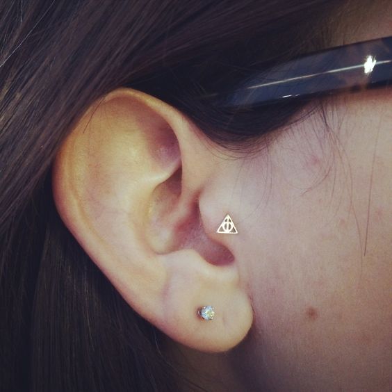 Right Ear Lobe And Tragus Piercing With Triangle Stud