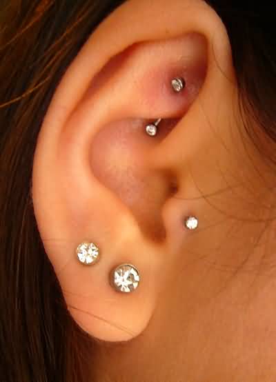 Rook, Dual Lobe And Tragus Piercing On Right Ear