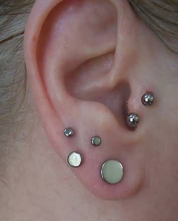 Silver Dermals Ear Lobe And Tragus Piercing With Silver Circular Barbell