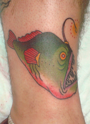 Simple Angler Fish Tattoo On Leg