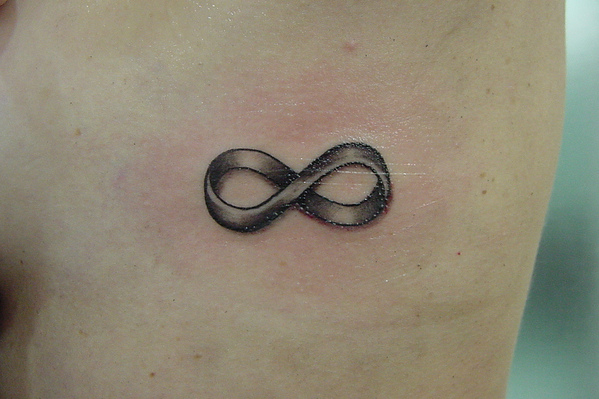 Simple Grey Infinity Symbol Tattoo On Side Rib