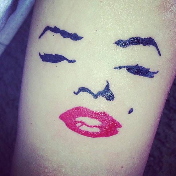 Simple Marilyn Monroe Face Tattoo On Arm