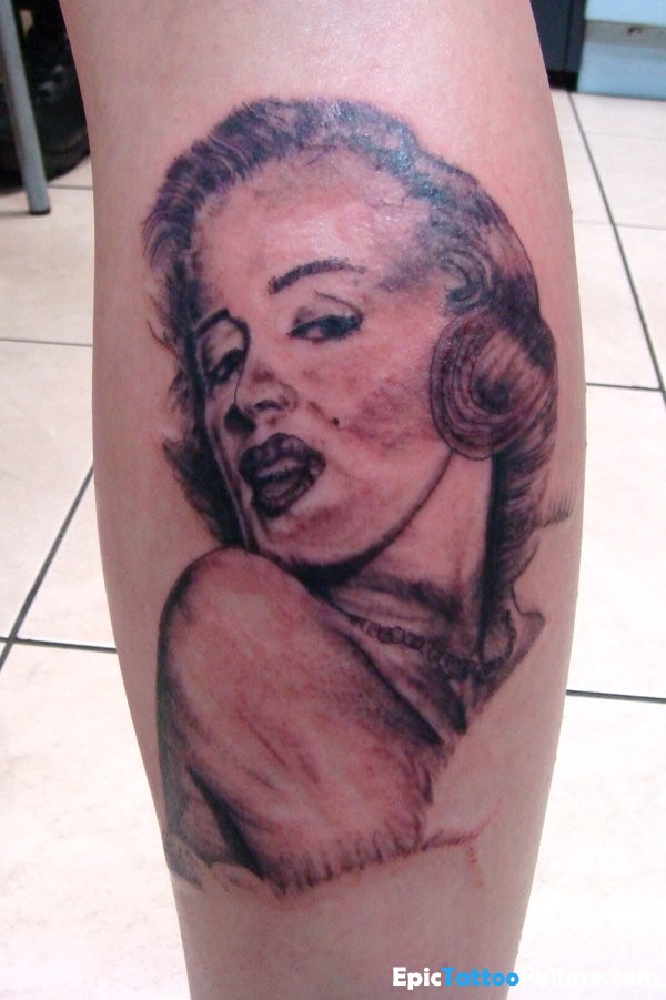Simple Marilyn Monroe Tattoo On Back Leg