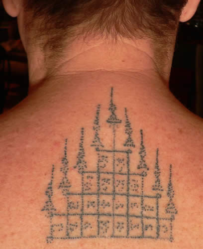 Simple Thai Temple Tattoo On Upper Back