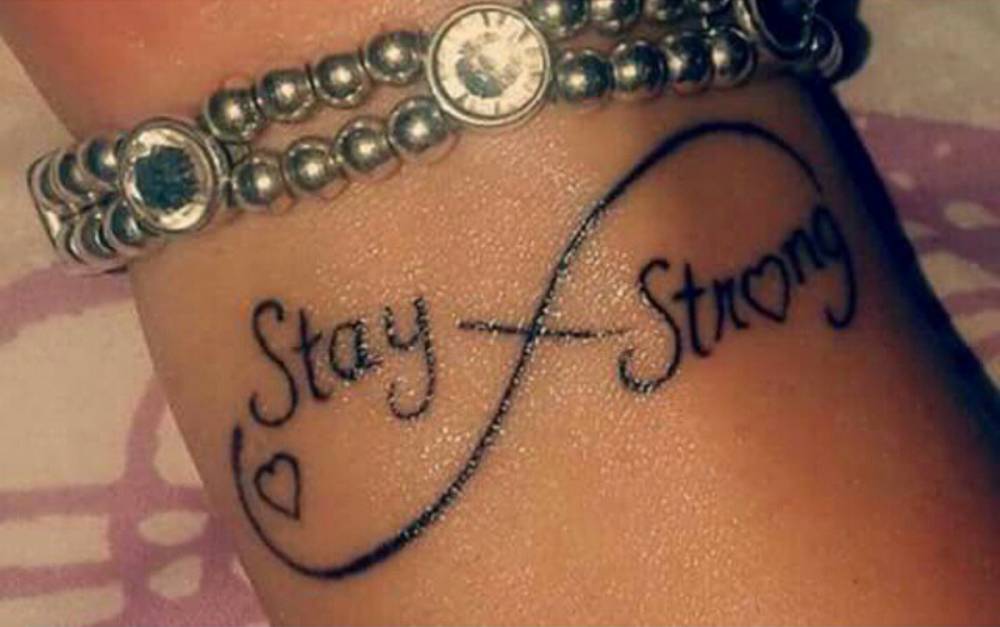 Stay Strong Infinity With Tiny Heart Tattoo On Wrist