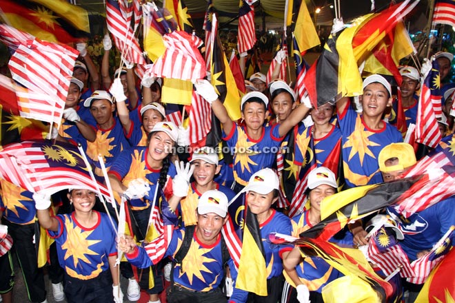 Students Wave Sarawak Flags During Malaysia Day Celebration In Sematan