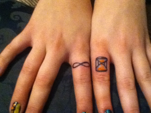 Tiny Infinity And Hourglass Tattoos On Fingers