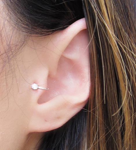 Tragus Piercing On Girl Left Ear
