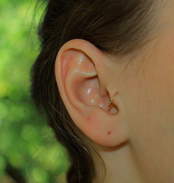 Tragus Piercing With Gold Ring For Girls