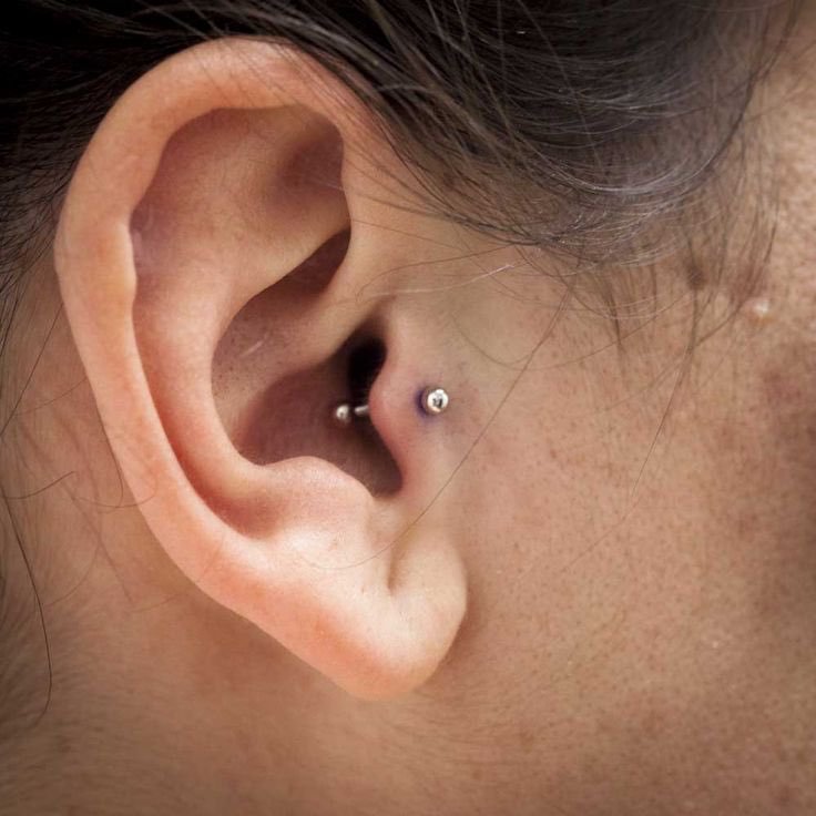 Tragus Piercing With Silver Barbell On Right Ear