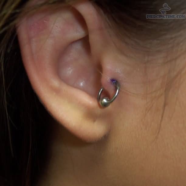 Tragus Piercing With Silver Hoop Ring