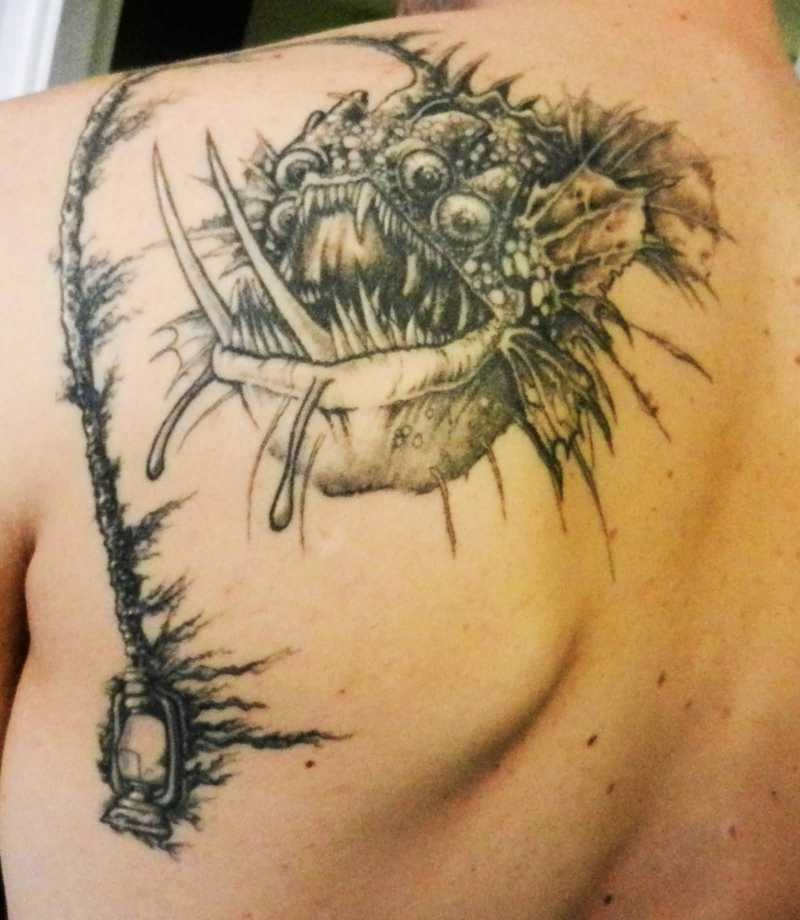 Unusual Angler Fish Tattoo On Back