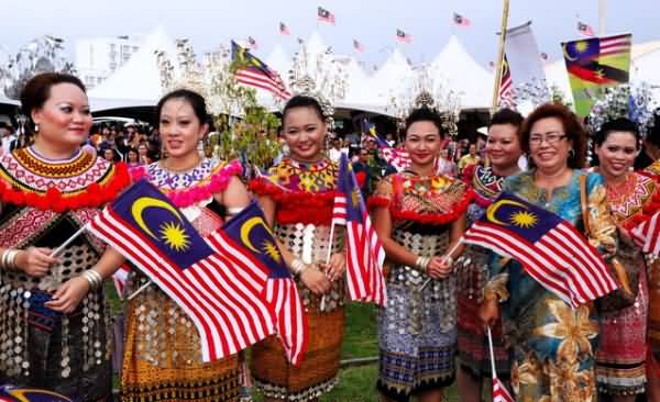 Women Of Malaysia With Flags During Malaysia Day Celebration