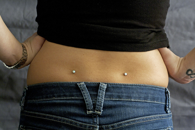 Amazing Lower Back Piercing With Opal Dermals