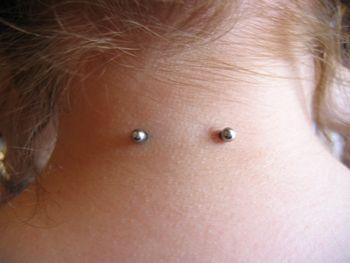 Amazing Surface Neck Piercing With Silver Barbell