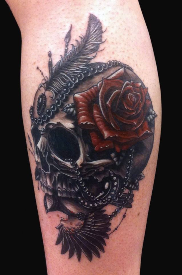 Amazing skull and rose tattoo on arm