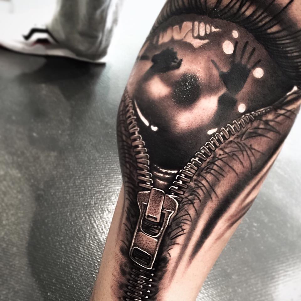 Amazing zipper tattoo on arm by Levi Barnett
