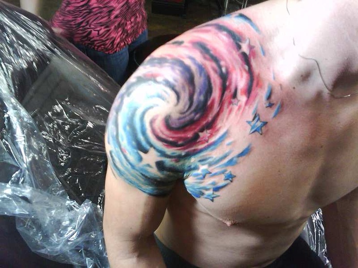 Attractive Blue Green Spiral Galaxy Tattoo On Right Shoulder For Men
