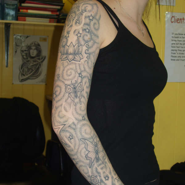 Attractive Sacred Spiral Tattoo On Right Full Arm For Girls