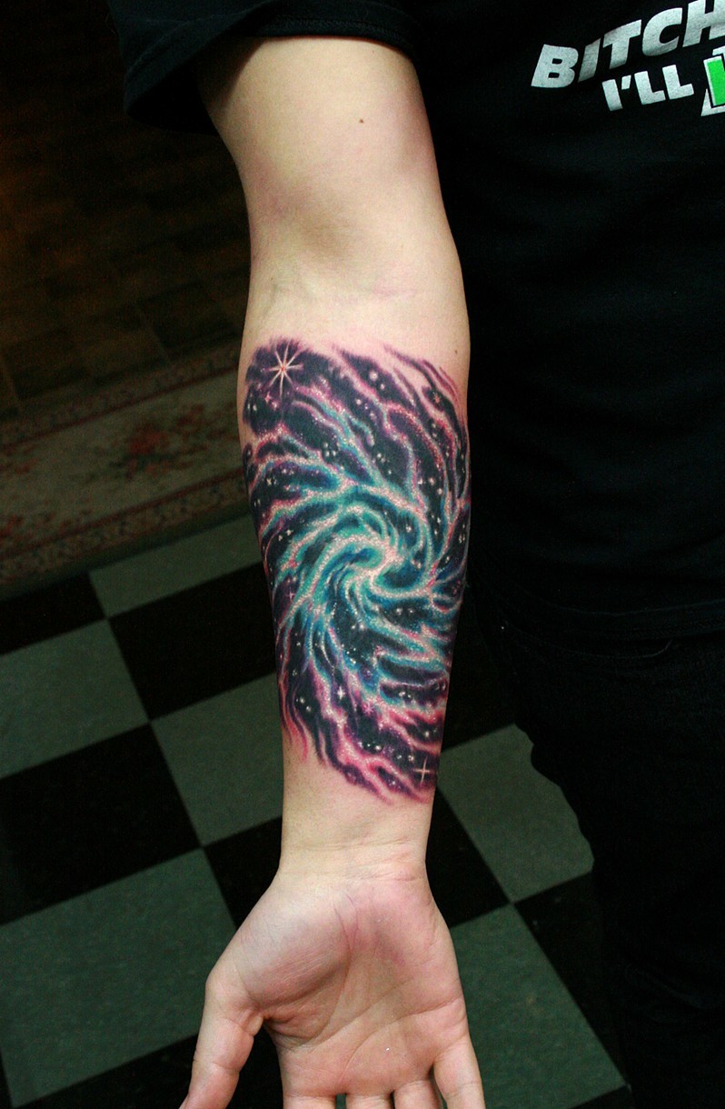 Awesome Spiral Galaxy Tattoo On Forearm