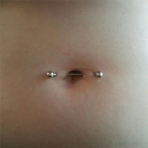 Awesome Surface Navel Piercing With Silver Barbell