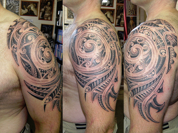Awesome Tribal Spiral Tattoo On Left Upper Arm For Men