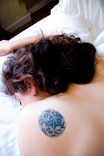 Awesome Triple Spiral Symbol Tattoo On Left Back Shoulder