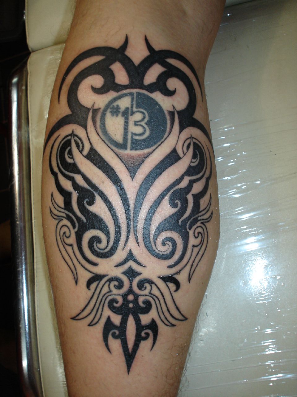 Back Leg Tribal Aztec Number Tattoo