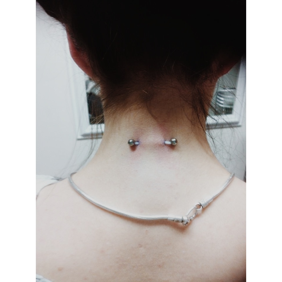 Back Neck Surface Piercing With Barbell