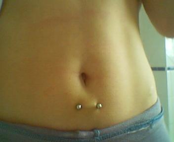 Barbell Surface Navel Piercing