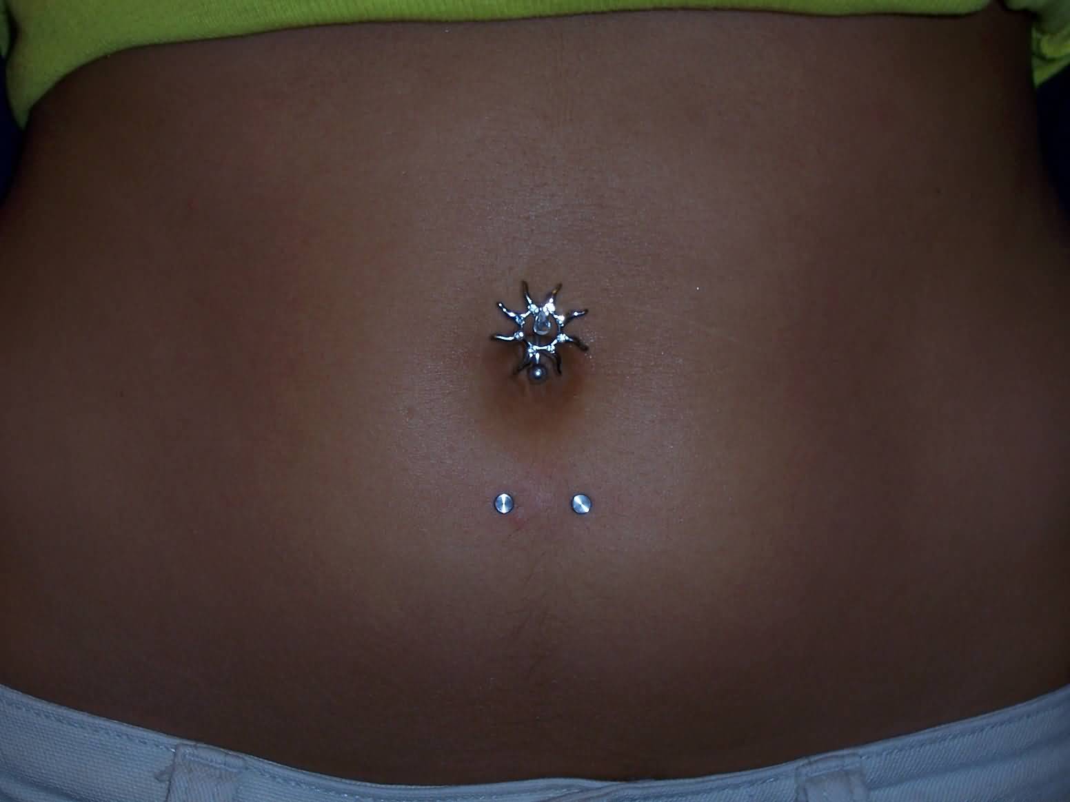Beautiful Belly Piercing With Sun Stud And Surface Navel Piercing With Dermal Anchors