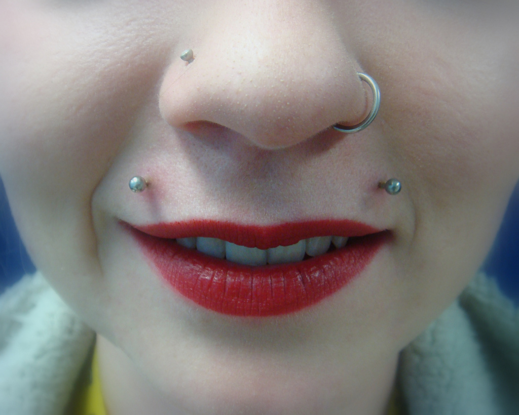 Beautiful Left Nostril And Top Lip Piercing