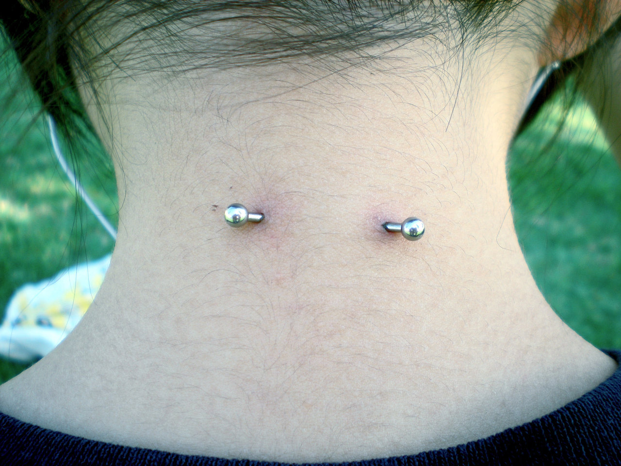 Beautiful Surface Neck Piercing With Silver Barbell