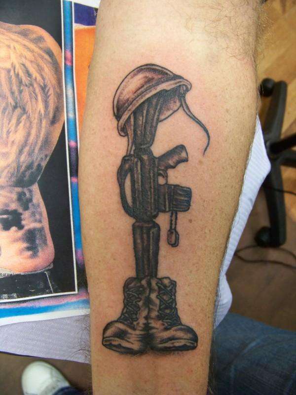 Black And Grey Soldier Remembrance Tattoo On Forearm